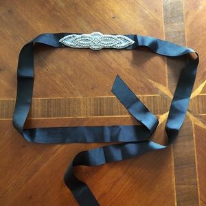 Black ribbon belt with rhinestone applique